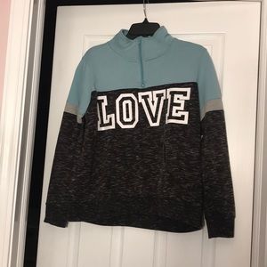 Teal and gray top with “LOVE” in white